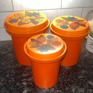 VINTAGE Rubbermaid orange floral canister set. Plastic with painted flowers.